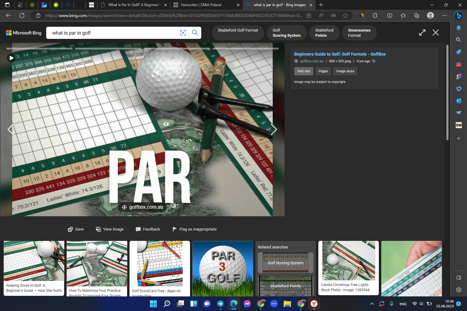 Table for recording golf scores, next to the golf ball