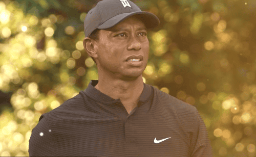 Tiger Woods in a hat and Nike t-shirt looking forward
