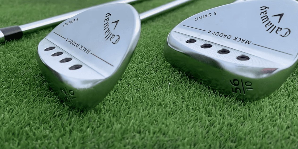 A close-up view of golf clubs resting on the grass