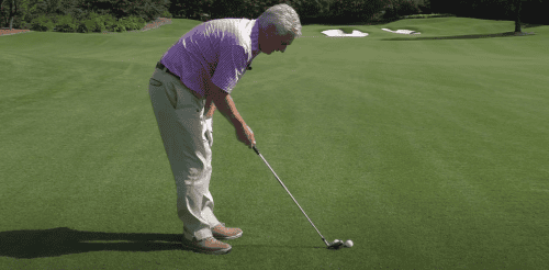 Person engaged in a game of golf