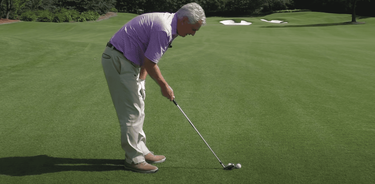 Person engaged in a game of golf
