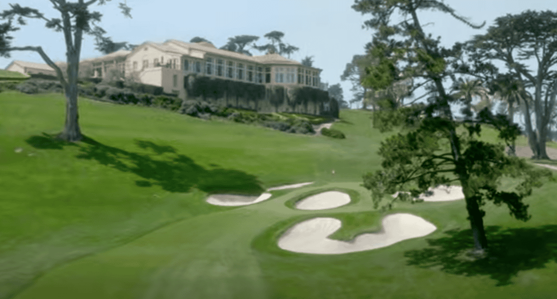 Distant view of a golf course with a prominent building