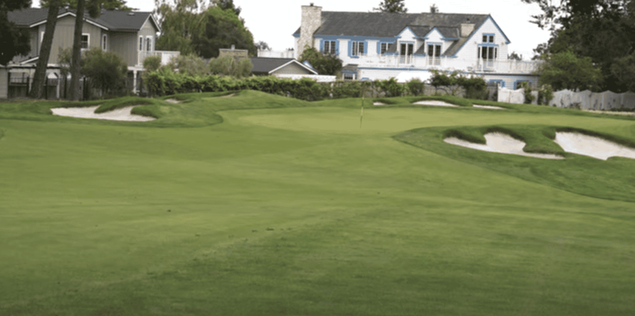Image of a golf course with visible houses