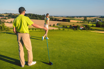 Man and Woman Golfing