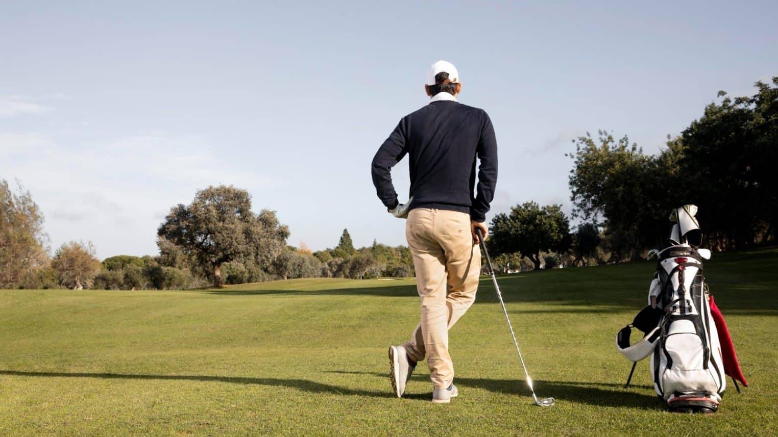 A man standing on a golf course
