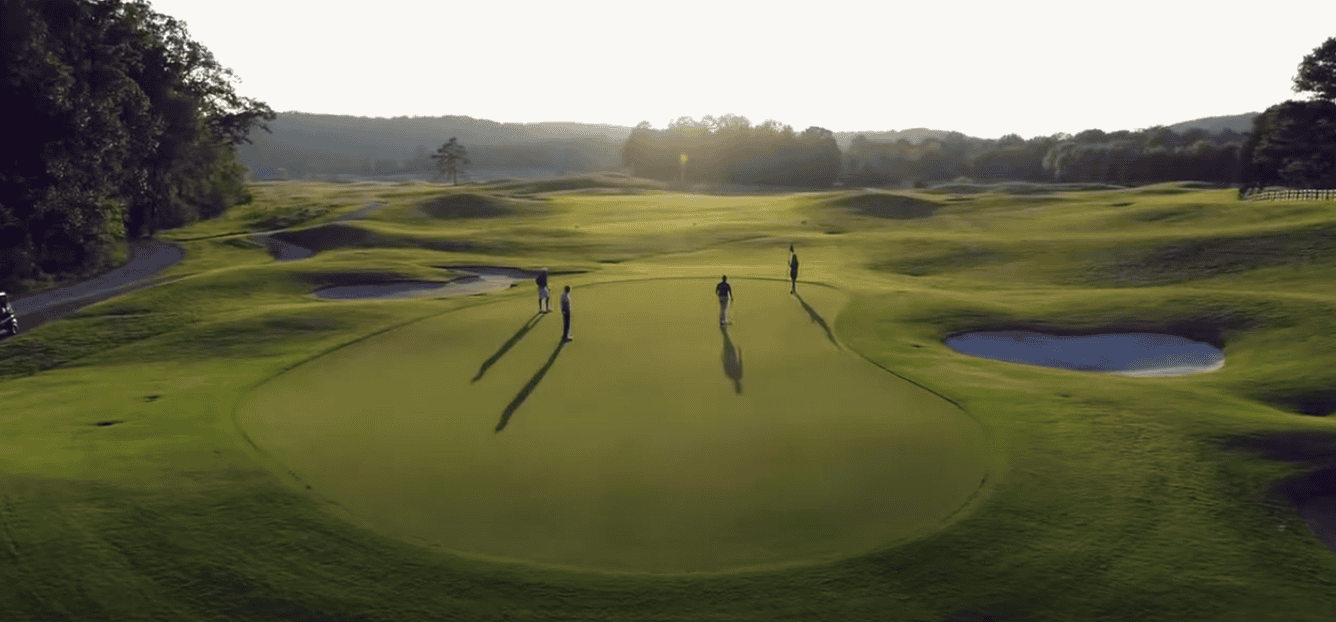 Top view of a golf course with people playing