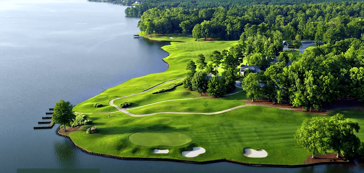 Aerial view of a golf course surrounded by numerous trees