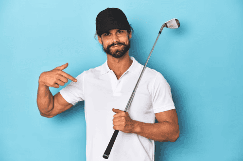Man with cap, holding a golf club and pointing at it
