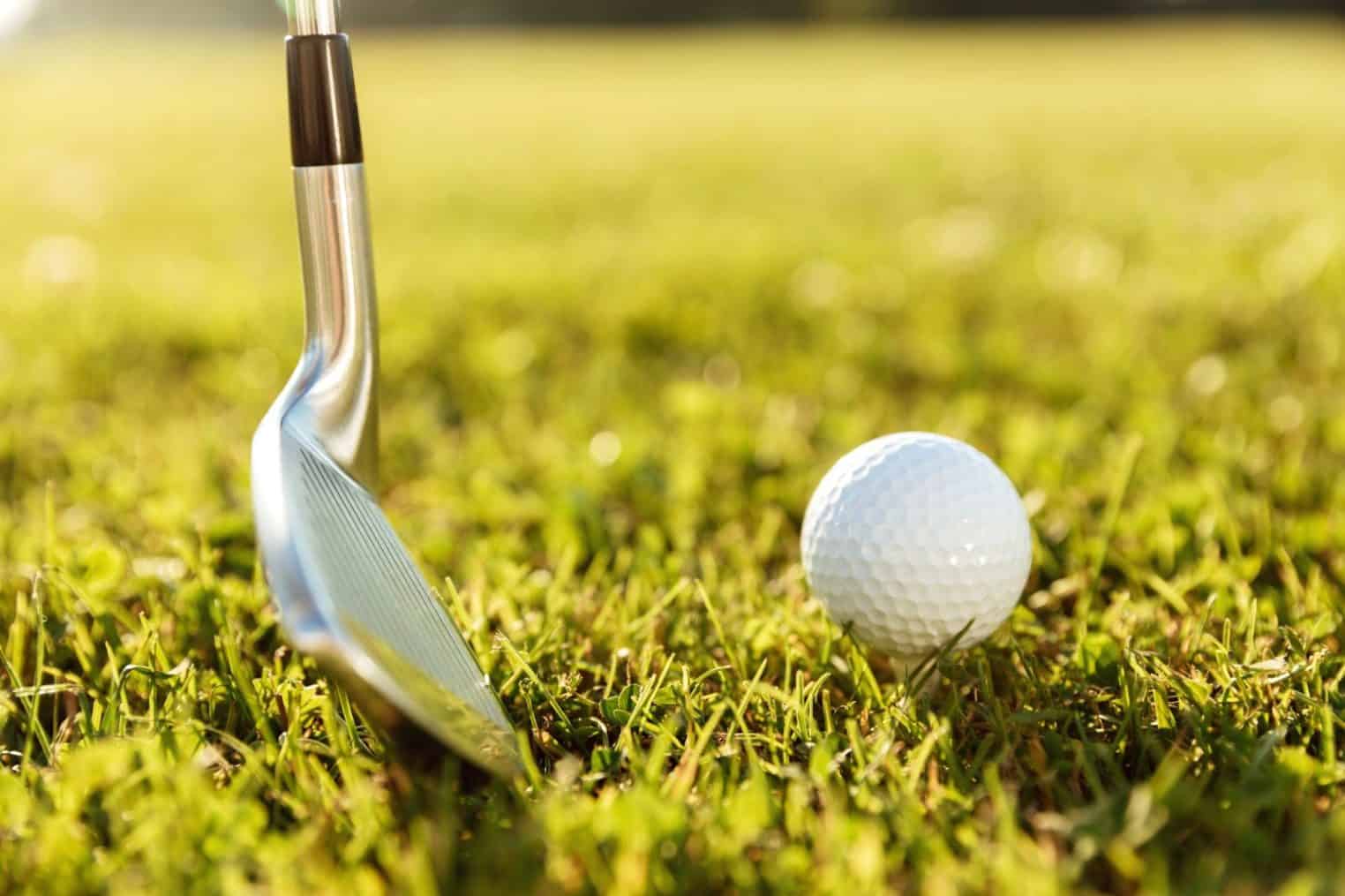 Close up of golf club and a ball